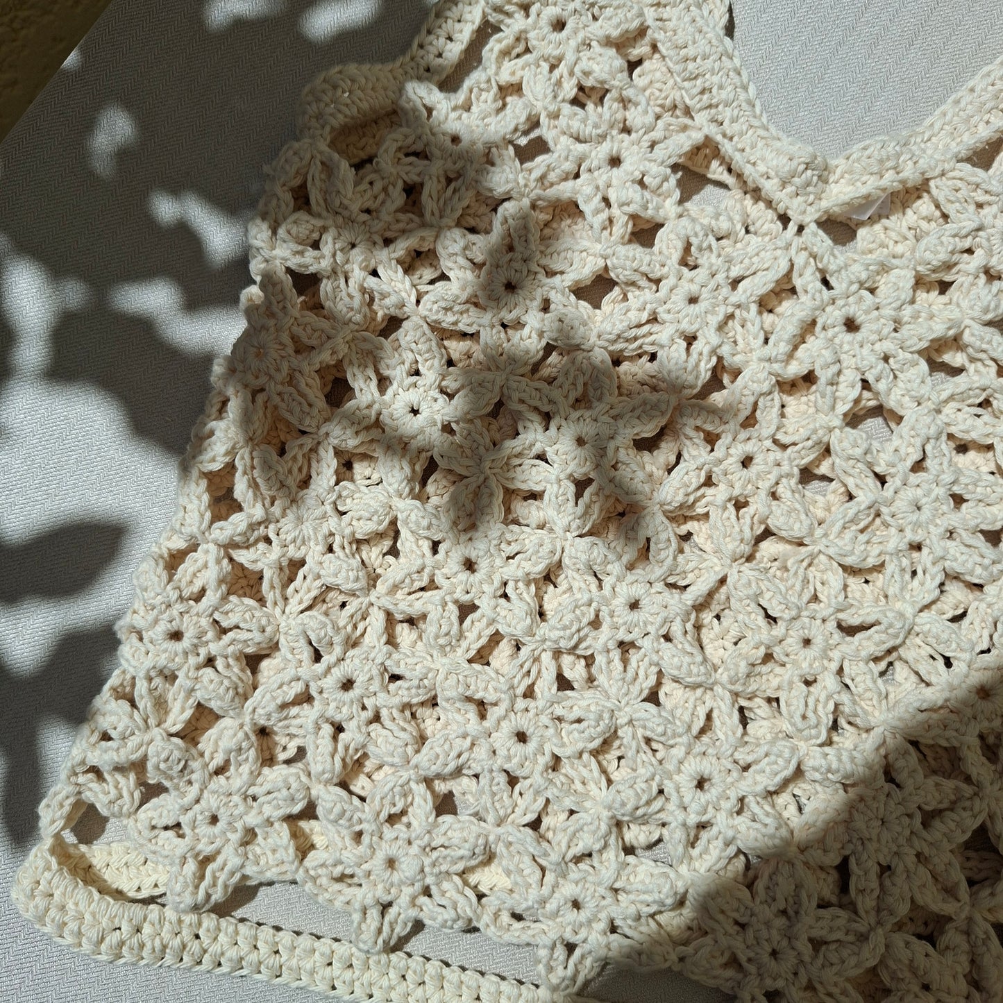 Top white crochet flowers