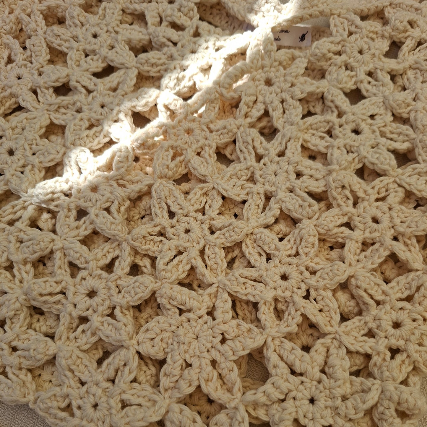 Top white crochet flowers