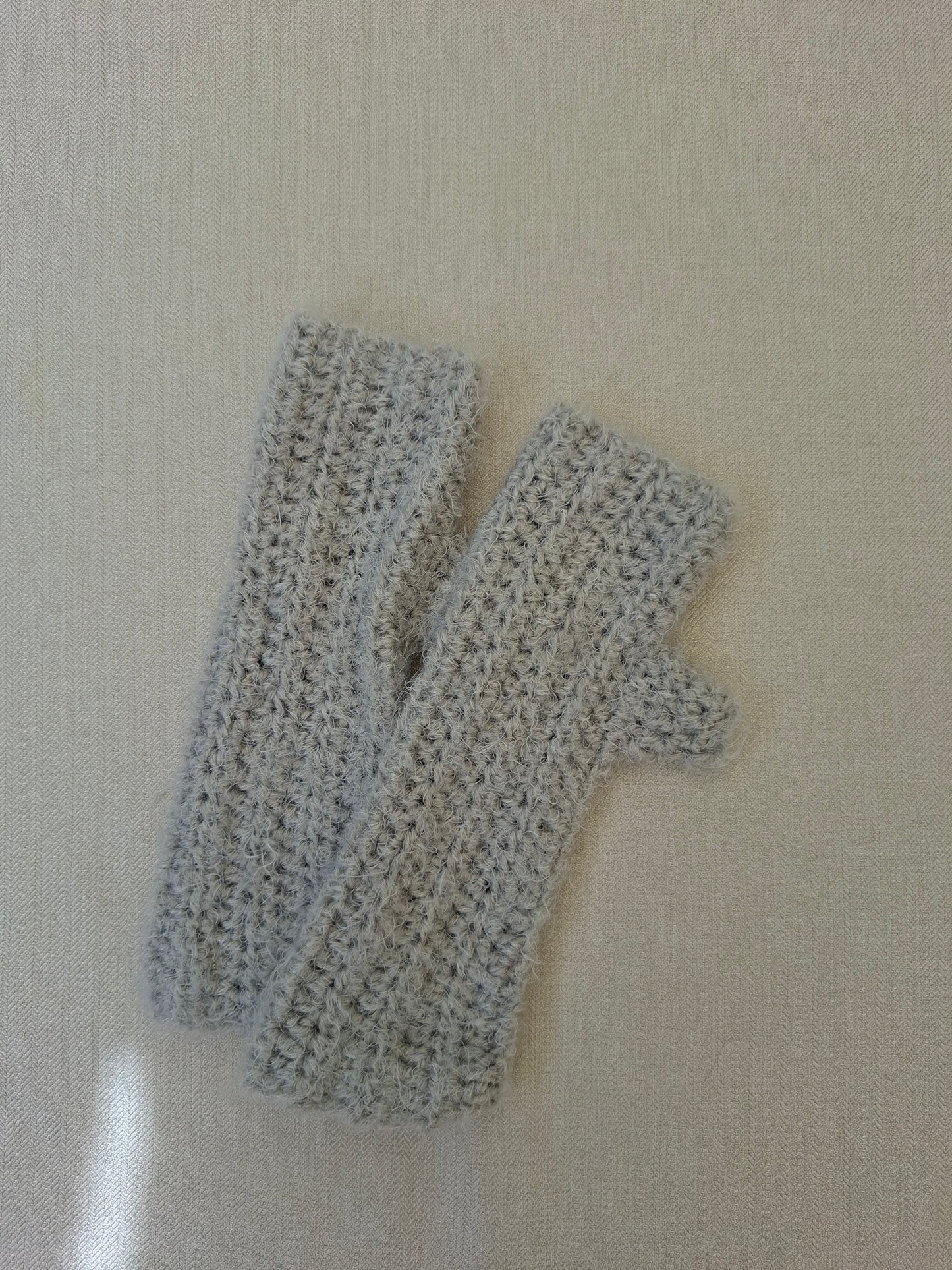 Grey crocheted mittens
