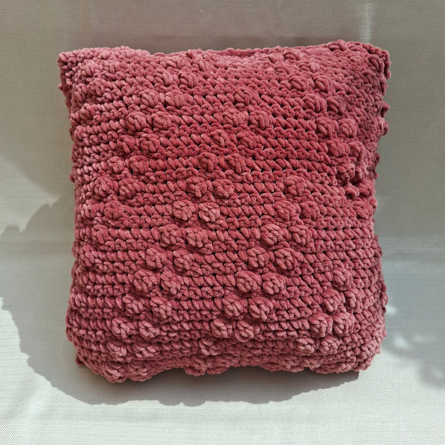 Two-tone crocheted cushion