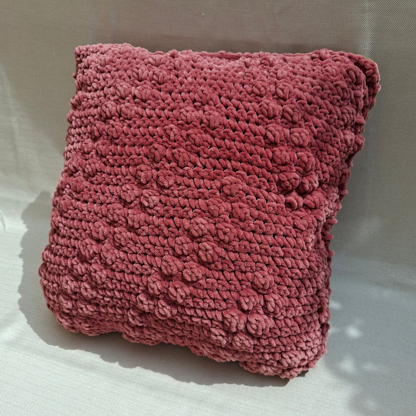 Two-tone crocheted cushion