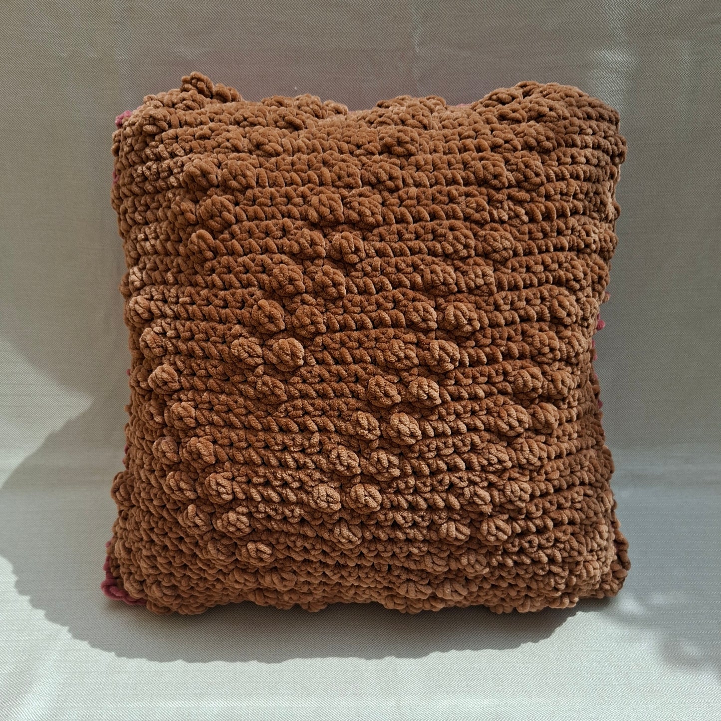 Two-tone crocheted cushion