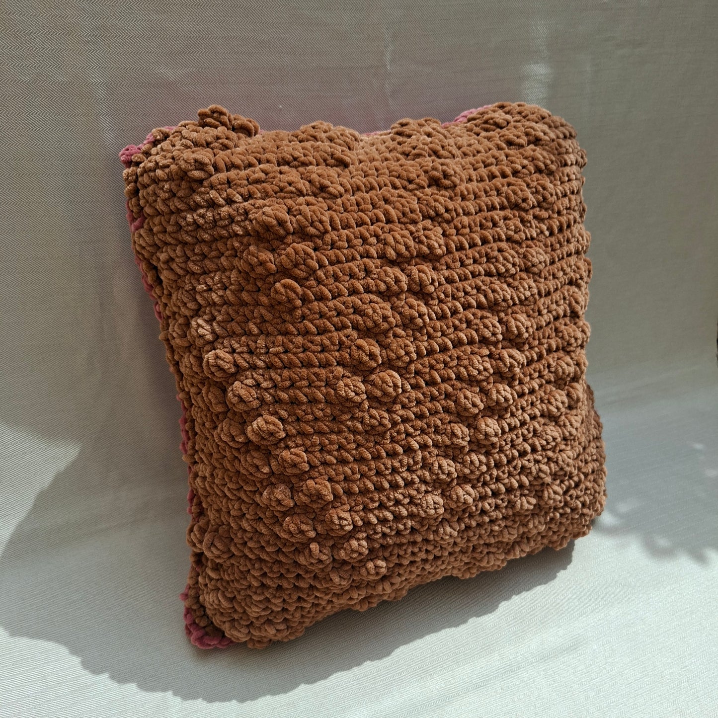 Two-tone crocheted cushion