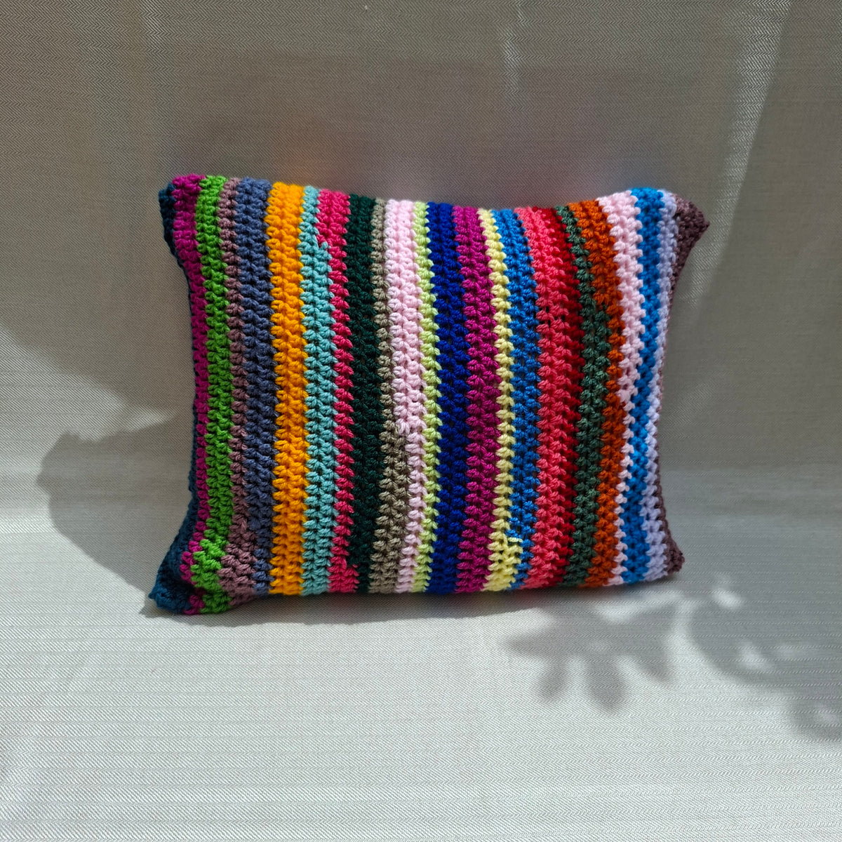 Multicolor striped crochet cushion