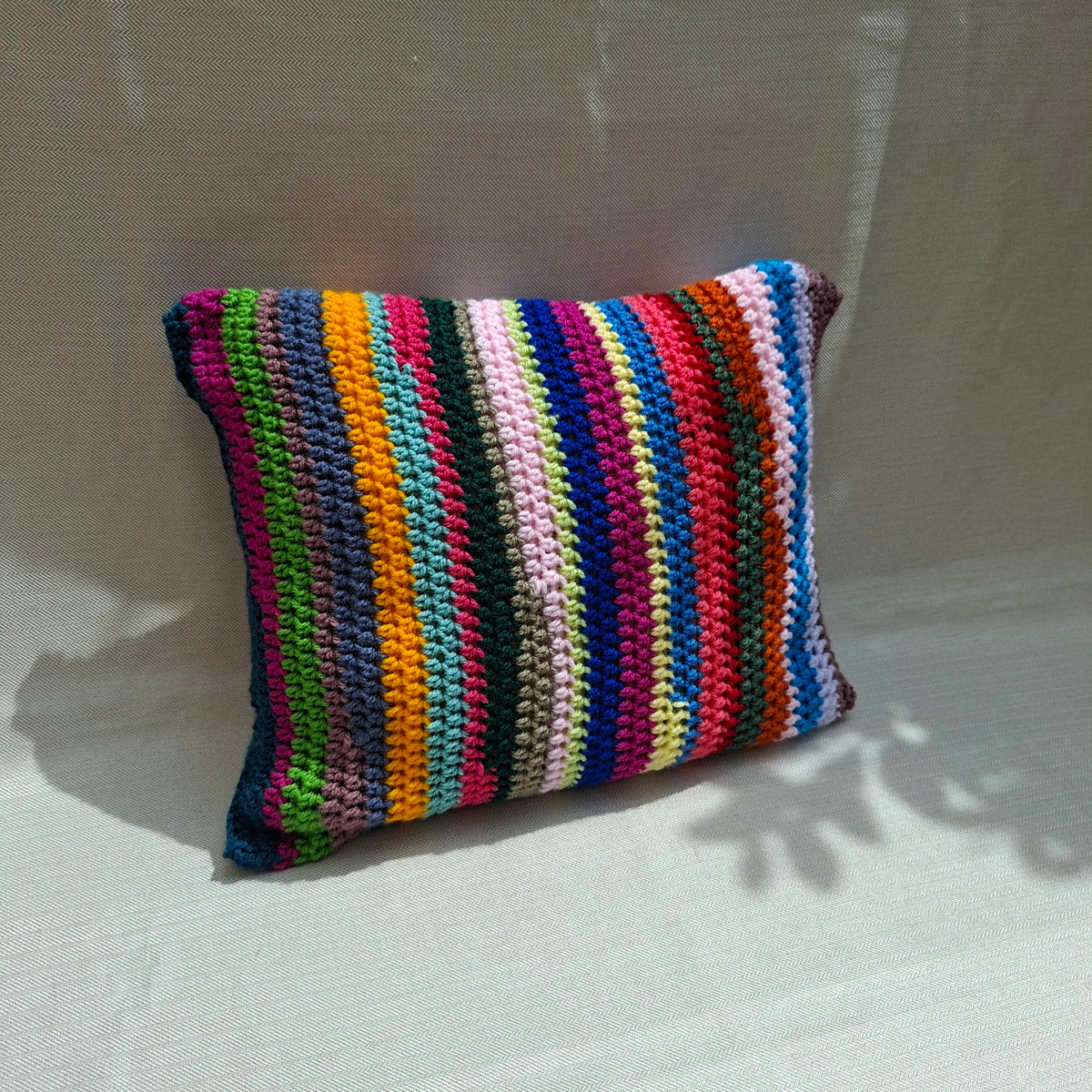 Multicolor striped crochet cushion