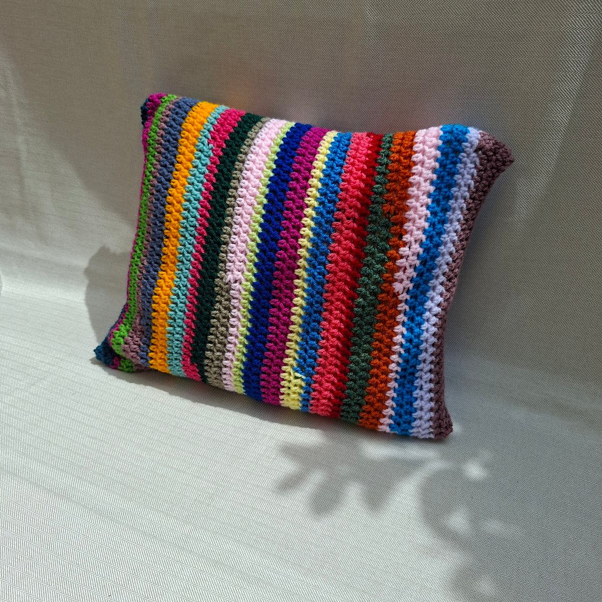 Multicolor striped crochet cushion