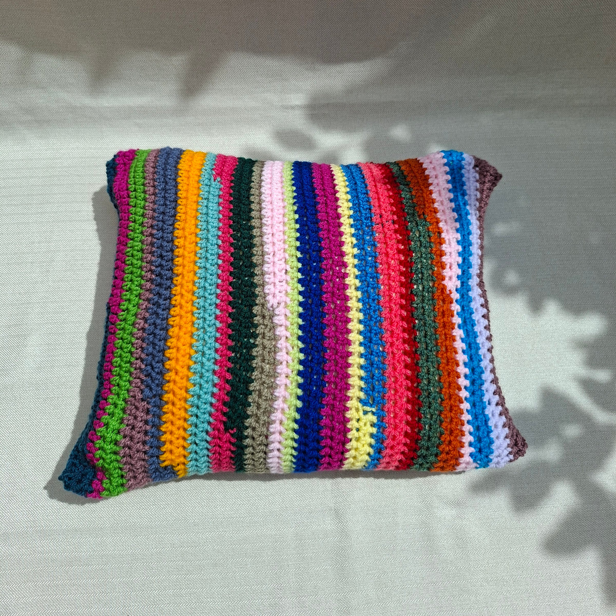 Multicolor striped crochet cushion