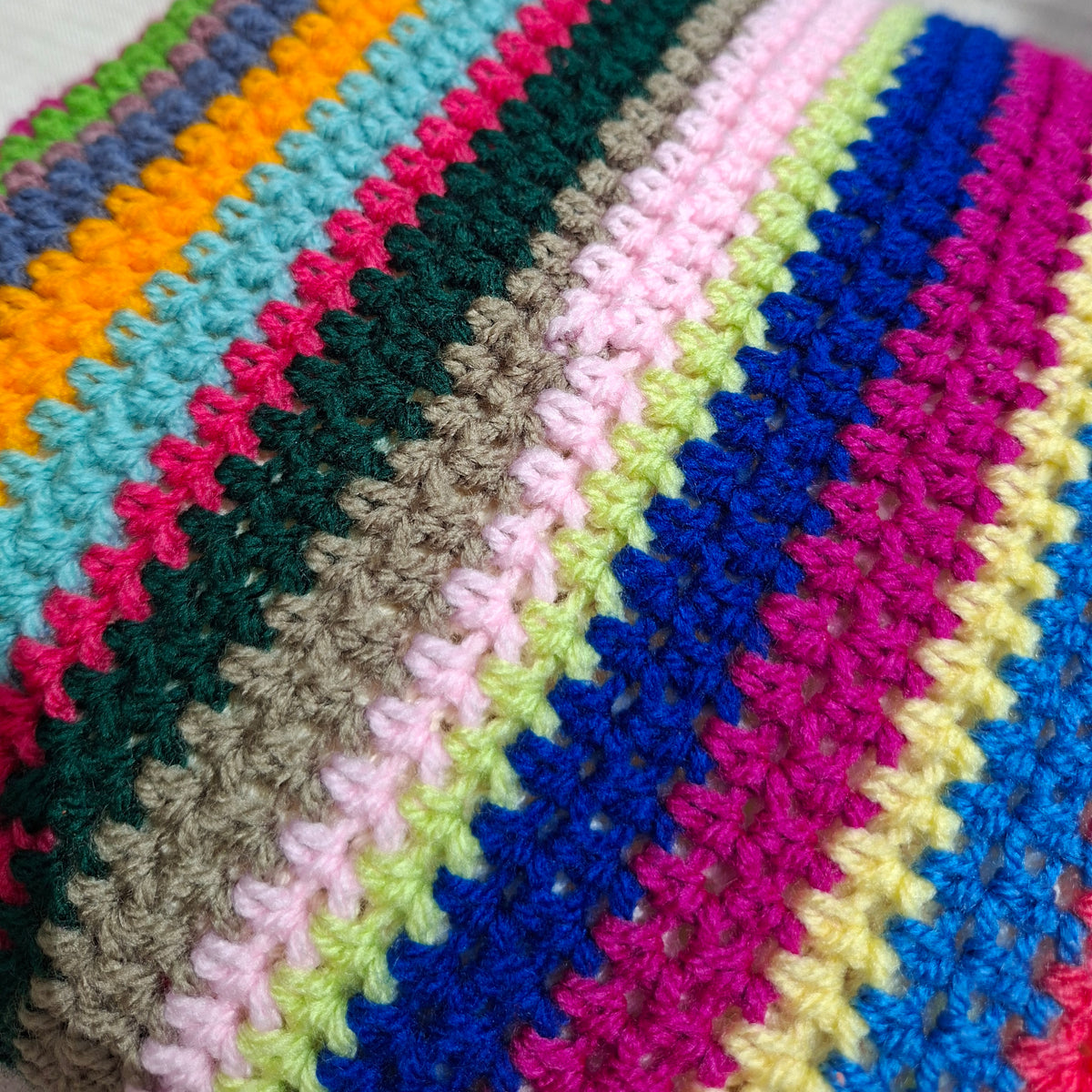 Multicolor striped crochet cushion