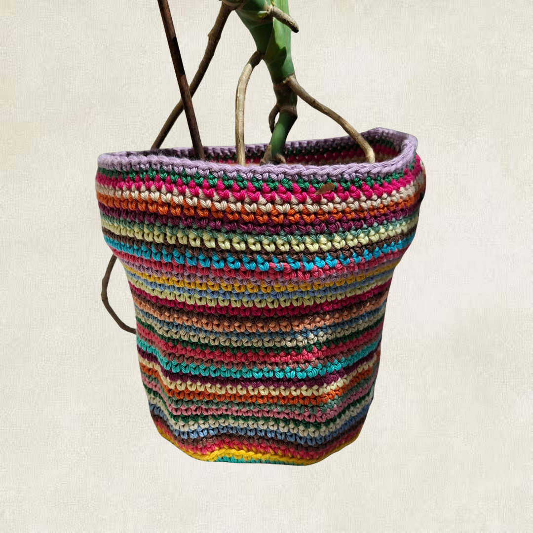 Multicoloured striped crochet plant pot cover